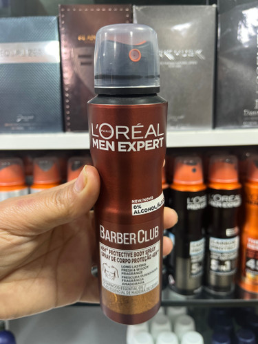 اسپری محافظتی بدن مردانه لورآل (L'Oréal Men Expert) مدل باربر کلاب - رایحه چوبی، بدون الکل، ۴۸ ساعته